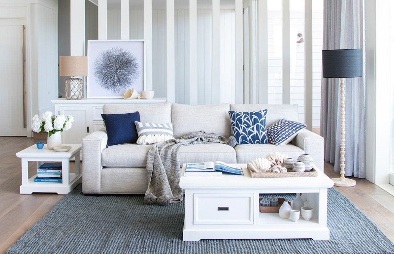 white living room bed and blue coastal Hamptons rug